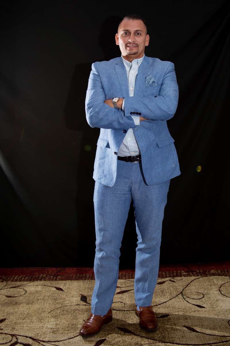 The owner of B&G Painting standing with arms crossed